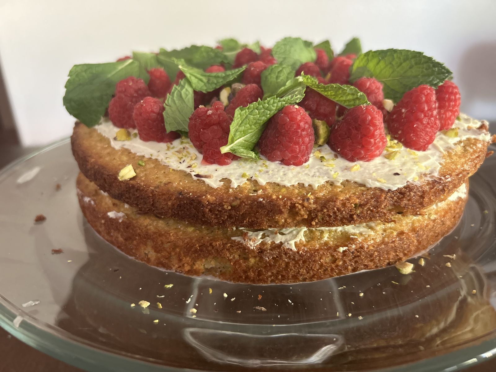 A finished cake on a table, photographed close and bright